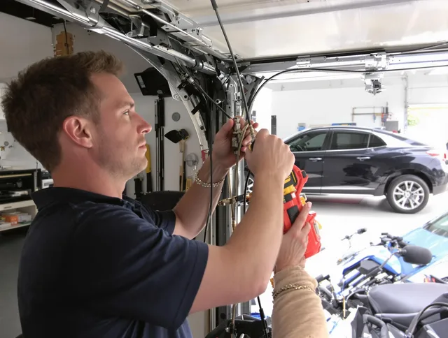 Brook Park Garage Door Repair safety certified technician performing cable replacement in Brook Park