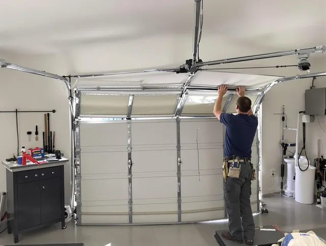 Brook Park Garage Door Repair specialist performing precise section replacement on Brook Park garage door